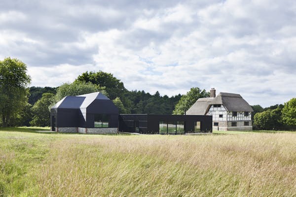 Image for Contemporary reinvention of a period farmyard creates 'a house of rare distinction' in Hampshire